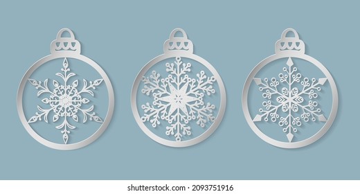 Christmas balls with pattern snowflake cut out of paper. Templates for laser or plotter cutting, printing. Great for Christmas cards, envelopes, invitations, interior elements. Die cut card. Vector