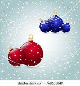 Christmas balls red blue on a snowy background