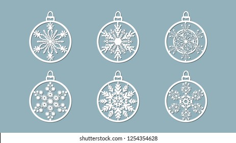 Christmas balls set with a snowflake cut out of paper. Templates for laser cutting, plotter cutting or printing. Festive background