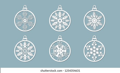 Christmas balls set with a snowflake cut out of paper. Templates for laser cutting, plotter cutting or printing. Festive background