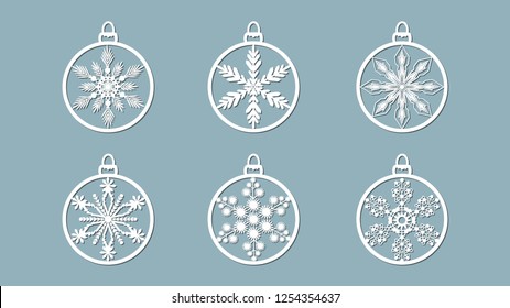 Christmas balls set with a snowflake cut out of paper. Templates for laser cutting, plotter cutting or printing. Festive background