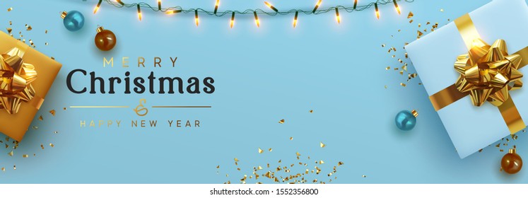 Christmas banner. Background Xmas design of sparkling lights garland, realistic gifts box, blue balls and glitter gold confetti. Horizontal christmas poster, greeting cards, headers for website