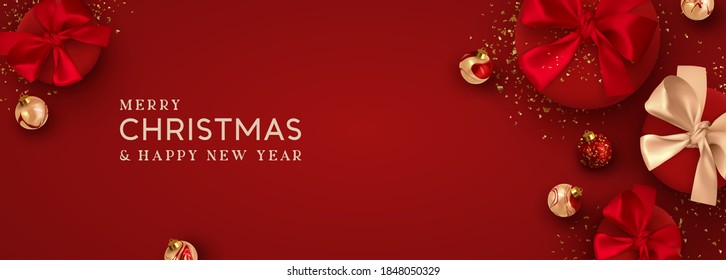 Christmas banner. Background Xmas design of realistic red gift box, 3d render bauble ball and glitter gold confetti. Horizontal christmas poster, greeting card, headers for website. Happy New Year.