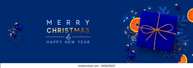 Christmas banner. Background Xmas design of realistic blue color ultramarine gifts box, ornament snowflake and glitter light garland, bauble ball. Horizontal poster, greeting card, headers for website