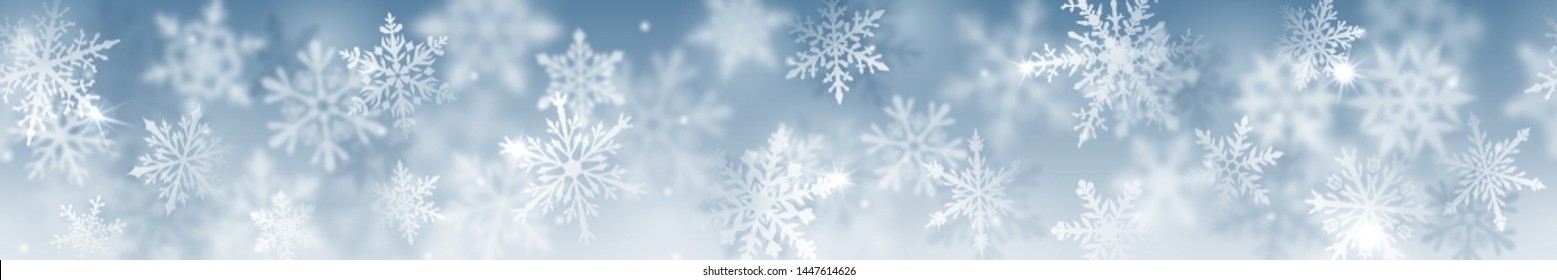 Christmas banner of complex blurred and clear snowflakes in white colors on light blue background. With horizontal repetition