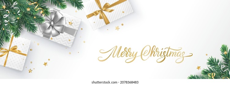 Christmas banner with decorated fir tree branches and presents. Gift boxes, golden and silver ribbons. Merry Christmas calligraphy. For New Year and winter holiday cards, headers, gift certificates.