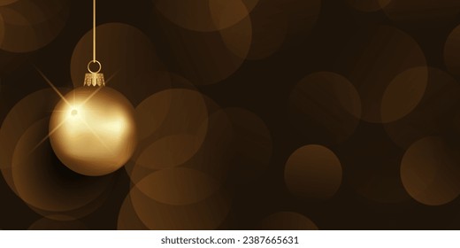 Christmas banner with hanging gold bauble on a bokeh lights background