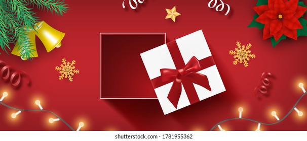 Christmas banner with open realistic gifts box, snowflake and confetti on red from top view.