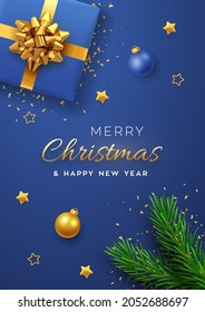 Christmas banner. Realistic blue gift box with golden bow, pine branches, gold stars and glitter confetti, balls bauble. Xmas background, cover, poster, greeting cards, headers website. Vector.