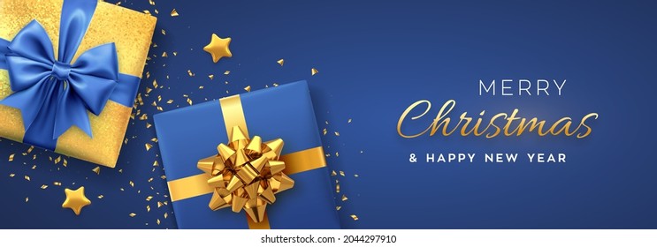 Christmas banner. Realistic gift boxes with golden and blue bows, gold stars and glitter confetti. Xmas background, horizontal christmas poster, greeting cards, headers website. Vector illustration.