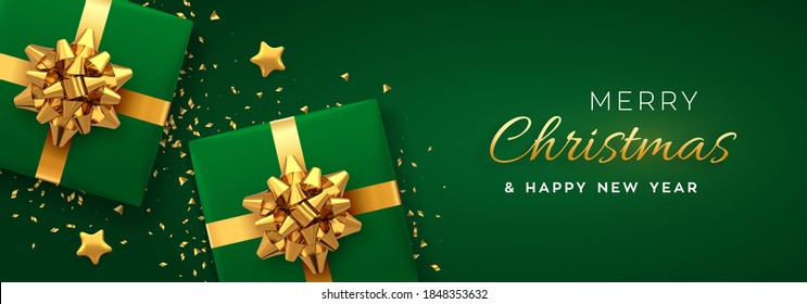 Christmas Banner. Realistic Green Gift Boxes With Golden Bow, Gold Stars And Glitter Confetti. Xmas Background, Horizontal Christmas Poster, Greeting Cards, Headers Website. Vector Illustration.