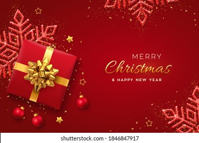 Christmas banner. Realistic red gift box with golden bow, shining snowflake, gold stars and glitter confetti, balls. Xmas background, horizontal poster, greeting cards, headers website. Vector.