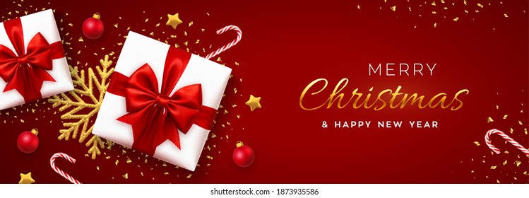 Christmas banner. Realistic white gift boxes with red bow, gold stars, shiny golden snowflake, balls and candy canes. Xmas red background, horizontal poster, greeting card, header website. Vector.