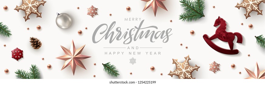 Christmas banner, timeline cover or header with Festive Elements - Rose Gold Stars, Glitter Snowflakes, Red wooden Rocking Horse and Pine Branches. Flat lay, top view.