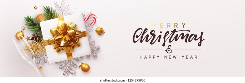 Christmas banner. Xmas bauble with gifts box and snowflake glitter, glasses champagne. Horizontal festive posters, greeting card, header, website. Objects viewed from above. Flat lay, Top view