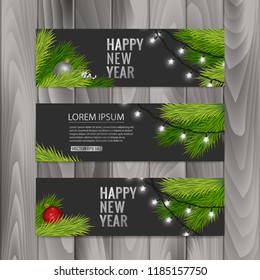 Christmas banners set with fir branches decorated with ribbons, red balls and garlands on wood background. Vector eps 10