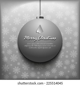 Christmas bauble on snowflakes background
