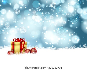 Christmas baubles and gift nestled in snow
