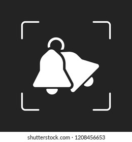 christmas bell icon. White object in camera autofocus on dark background