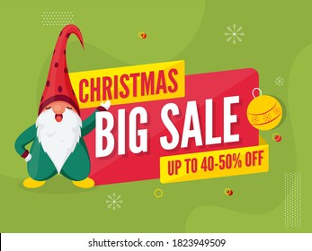 Christmas Big Sale Poster Design with 40-50% Discount Offer and Cartoon Gnome Character on Green Background.