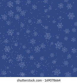 Christmas blue background with falling snowflakes