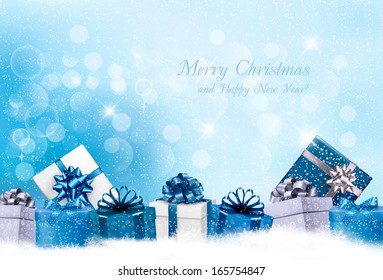 Christmas blue background with gift boxes and snowflakes. Vector