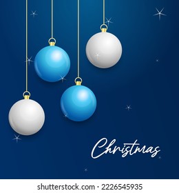 Christmas blue background with hanging shining white and Silver balls. Merry christmas greeting card