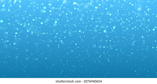 Fondo azul de Navidad con nieve.