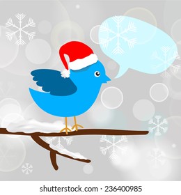 Christmas blue bird with message bubble sitting on a tree branch
