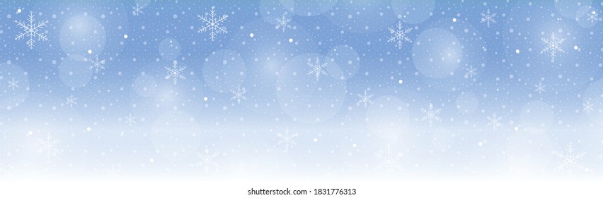 Christmas blue bokeh with white glare snowflakes