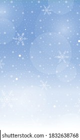 Christmas blue bokeh with white glare snowflakes