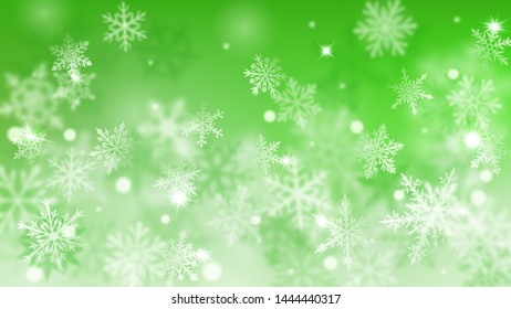 Christmas blurred background of complex defocused big and small falling snowflakes in green colors with bokeh effect