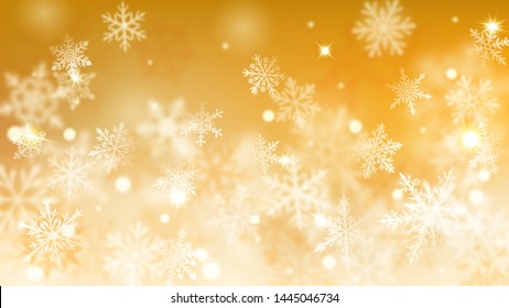 Christmas blurred background of complex defocused big and small falling snowflakes in yellow colors with bokeh effect