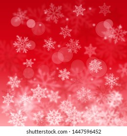 Christmas blurred background of complex defocused big and small falling snowflakes in red colors with bokeh effect