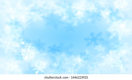 Christmas blurred background with frame of complex defocused big and small snowflakes in light blue colors with bokeh effect