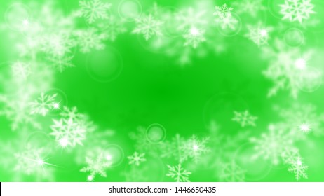 Christmas blurred background with frame of complex defocused big and small snowflakes in green colors with bokeh effect