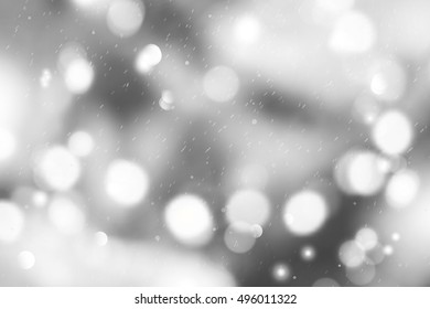 christmas blurred background with garland lights and snowfall