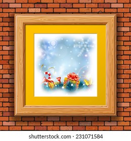 Christmas Blurred Bokeh Background with Snowflakes, Gift, Fir Branches, Gold Streamer and Candy in Wooden Frame on Brick Wall.