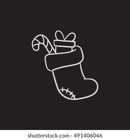Christmas boot with gift and candy cane vector sketch icon isolated on background. Hand drawn Christmas boot with gift and candy cane icon. Christmas boot sketch icon for infographic, website or app. Christmas boot with gift and candy cane vector sketch icon isolated on background. Hand drawn Christmas boot with gift and candy cane icon. Christmas boot sketch icon for infographic, website or app.