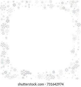 Christmas border or frame with random scatter falling silver snowflakes isolated on white.