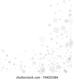 Christmas border or frame with random scatter falling silver snowflakes isolated on white.