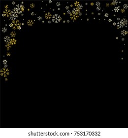 Christmas border or frame with random scatter falling golden snowflakes isolated on black.