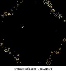 Christmas border or frame with random scatter falling golden snowflakes isolated on black.