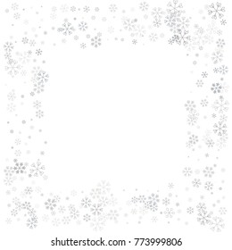 Christmas border or frame with random scatter falling silver snowflakes isolated on white.