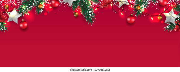 Christmas border with pine tree branch, white snow, Christmas balls, star, and sparkling lights isolated on red background. Copy space. Xmas holidays banner. Vector illustration.