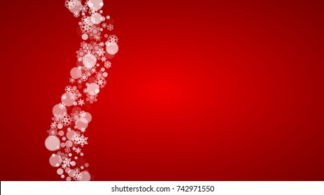 Christmas border with white snowflakes on red background. Santa Claus colors. Horizontal Merry Christmas border for season sales, banners, invitations, retail offers. Falling snow. Frosty winter back.