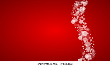Christmas border with white snowflakes on red background. Santa Claus colors. Horizontal Merry Christmas border for season sales, banners, invitations, retail offers. Falling snow. Frosty winter back.