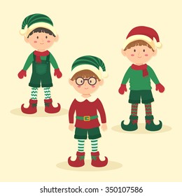 Christmas boy elves with different green and red costumes standing on simple yellow background.