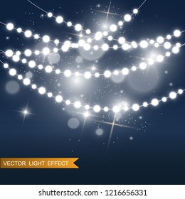 Christmas bright, beautiful lights, design elements. Glowing lights for design of Xmas greeting cards. Garlands, light Christmas decorations.