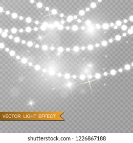 Christmas bright, beautiful lights, design elements. Glowing lights for design of Xmas greeting cards. Garlands, light Christmas decorations.